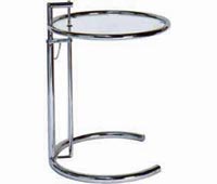 Table with moveable top by Eileen Gray