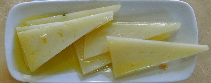 Tapa of cured cheese